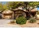 Inviting home featuring a three car garage and mature shade trees in a well kept front yard at 19308 W Jefferson St, Buckeye, AZ 85326