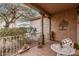 Inviting front porch with decorative accents, seating, and a cozy atmosphere at 19308 W Jefferson St, Buckeye, AZ 85326