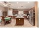 Spacious kitchen features a central island, tile floors, and stainless steel appliances at 19308 W Jefferson St, Buckeye, AZ 85326