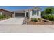 Charming single-story home with a two-car garage and well-maintained desert landscaping at 19756 W Roma Ave, Litchfield Park, AZ 85340