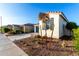 Side view of a single story home with drought-tolerant landscaping at 19756 W Roma Ave, Litchfield Park, AZ 85340