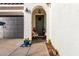 Inviting entryway with a charming porch and a grey door at 19756 W Roma Ave, Litchfield Park, AZ 85340