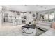 Modern kitchen with white cabinets, a large island, and stainless steel appliances at 19756 W Roma Ave, Litchfield Park, AZ 85340