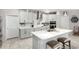 Modern kitchen with white shaker cabinets and a large kitchen island at 19756 W Roma Ave, Litchfield Park, AZ 85340