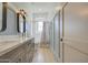 Modern bathroom with gray vanity, white subway tile, and a shower/tub combo at 20628 E Natalie Way, Queen Creek, AZ 85142