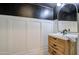 Modern powder room with a stylish sink and dark-painted walls at 20628 E Natalie Way, Queen Creek, AZ 85142