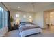 Serene bedroom with a queen-size bed and ample natural light from large windows at 20628 E Natalie Way, Queen Creek, AZ 85142