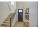 Bright and airy entryway with modern light fixture and wooden flooring at 20628 E Natalie Way, Queen Creek, AZ 85142