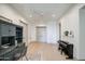 Light and airy hallway featuring hardwood floors and built-in shelving at 20628 E Natalie Way, Queen Creek, AZ 85142