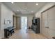 Light and airy hallway with hardwood floors, built-in shelving, and a piano at 20628 E Natalie Way, Queen Creek, AZ 85142