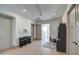 Bright hallway with hardwood floors, built-in shelving, and a piano at 20628 E Natalie Way, Queen Creek, AZ 85142