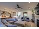 Bright and airy living room with a cozy seating area and a view to the kitchen and staircase at 20628 E Natalie Way, Queen Creek, AZ 85142