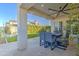 Covered patio with seating area and ceiling fan at 20628 E Natalie Way, Queen Creek, AZ 85142