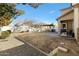 Landscaped backyard with pergola and patio at 2212 E Sunland Ave, Phoenix, AZ 85040