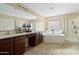 Bathroom boasts double vanity, soaking tub and shower at 2212 E Sunland Ave, Phoenix, AZ 85040