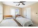 Bedroom with two twin beds and ceiling fan at 2212 E Sunland Ave, Phoenix, AZ 85040