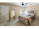 Large bedroom with ceiling fan and plush bedding at 2212 E Sunland Ave, Phoenix, AZ 85040