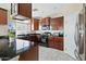 Spacious kitchen with dark wood cabinets at 2212 E Sunland Ave, Phoenix, AZ 85040