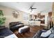 Living room with dark leather furniture at 2212 E Sunland Ave, Phoenix, AZ 85040