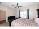 Bright bedroom with a queen-size bed and ceiling fan at 234 N Seymour --, Mesa, AZ 85207