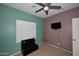 Bedroom with two-tone walls, window coverings, and TV at 234 N Seymour --, Mesa, AZ 85207