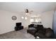 Living room featuring a sectional sofa and ceiling fan at 234 N Seymour --, Mesa, AZ 85207