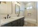 Modern bathroom boasts double vanity, marble tile, and bathtub at 2383 E Cana Ln, Casa Grande, AZ 85194