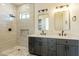 Modern bathroom with double vanity and walk-in shower at 2383 E Cana Ln, Casa Grande, AZ 85194