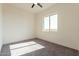 Spacious bedroom featuring a window with natural light and ceiling fan at 2383 E Cana Ln, Casa Grande, AZ 85194