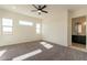 Bright bedroom with carpeting, ceiling fan, and access to patio at 2383 E Cana Ln, Casa Grande, AZ 85194