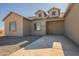 New construction home entrance with two-car garage at 2383 E Cana Ln, Casa Grande, AZ 85194