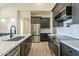 Modern kitchen with island, stainless steel appliances, and white cabinetry at 2383 E Cana Ln, Casa Grande, AZ 85194