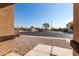 View of the backyard with a gravel area and a fire pit at 25360 W Fremont Ct, Buckeye, AZ 85326