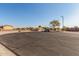 View of the backyard with a gravel area and a fire pit at 25360 W Fremont Ct, Buckeye, AZ 85326