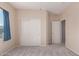 Bright bedroom with double door closet and carpet flooring at 25360 W Fremont Ct, Buckeye, AZ 85326