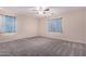 Empty bedroom with carpet flooring and ceiling fan at 25360 W Fremont Ct, Buckeye, AZ 85326