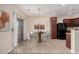 Dining area with modern light fixture and access to the backyard at 25360 W Fremont Ct, Buckeye, AZ 85326