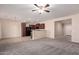 Open concept kitchen with dark wood cabinets and granite countertops at 25360 W Fremont Ct, Buckeye, AZ 85326