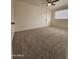 Well-lit bedroom with ceiling fan and carpeted floor at 2611 N 40Th Ave, Phoenix, AZ 85009