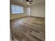 Living room with laminate flooring and window blinds at 2611 N 40Th Ave, Phoenix, AZ 85009