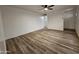 Bright living room features wood-look floors and ceiling fan at 2611 N 40Th Ave, Phoenix, AZ 85009