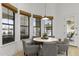 Dining area with natural light, neutral decor, and a view of the pool and backyard at 2916 E Arrowhead Trl, Gilbert, AZ 85297