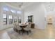 Bright dining room with high ceilings, large windows and a view to the neighborhood at 2916 E Arrowhead Trl, Gilbert, AZ 85297