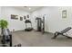 Home gym featuring workout machines and weights on rubber flooring at 2916 E Arrowhead Trl, Gilbert, AZ 85297