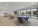 Bright game room with a round dining table and ping pong table, perfect for entertaining at 2916 E Arrowhead Trl, Gilbert, AZ 85297