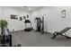 Spacious home gym with motivational decor, a full range of equipment, and rubber flooring at 2916 E Arrowhead Trl, Gilbert, AZ 85297