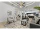 Bright and airy living room with tray ceiling, modern furnishings, and hardwood floors at 2916 E Arrowhead Trl, Gilbert, AZ 85297