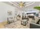 Comfortable living room featuring stylish furniture, a custom designed ceiling, and seamless access to the kitchen and dining areas at 2916 E Arrowhead Trl, Gilbert, AZ 85297