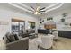 Sophisticated living room with neutral tones, designer rug, and backyard views at 2916 E Arrowhead Trl, Gilbert, AZ 85297