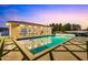 Backyard pool and patio area with travertine decking at 2916 E Arrowhead Trl, Gilbert, AZ 85297